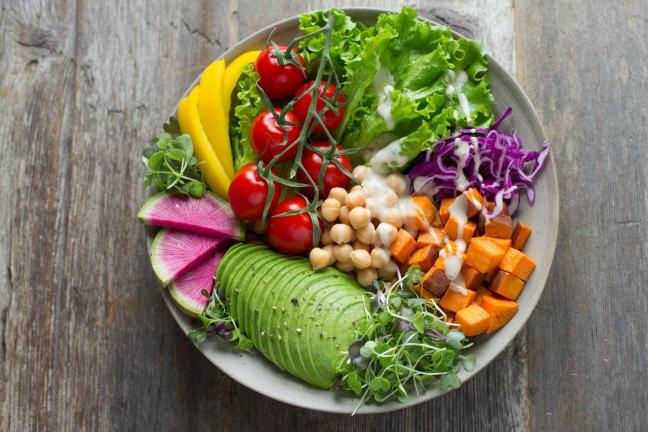 Bowl of colourful salad - healthy eating is one of the daily habits that could help you transform your life